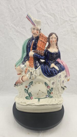 Victorian Staffordshire Flatback Pottery Clock Group - Scottish Highland Couple with Bagpipes, circa 1860-1880