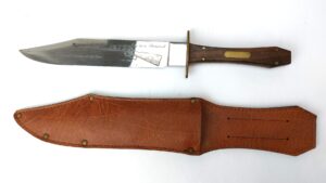 Late 20th Century Commemorative Bowie Knife, 'Legendary Gun of the West – One in a Thousand 1873 Special' Etched Blade, with Leather Sheath